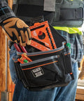 Close-up of hand holding a Seven Inch Double Laser Etched Aluminum Rafter Square With Badass Accuracy And No Hassle Multifunctional Carpenter Measuring Layout Tool.