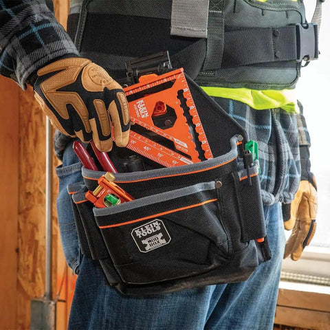 Close-up of hand holding a Seven Inch Double Laser Etched Aluminum Rafter Square With Badass Accuracy And No Hassle Multifunctional Carpenter Measuring Layout Tool.