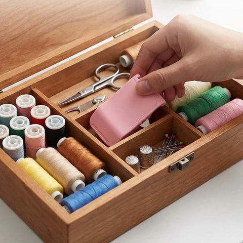 Hand using Seam Guide With Magnetic Alignment For Sewing Machines, Easy Clamp Tool For Precise Stitching, in sewing box.
