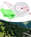 Thumb Compass For Hiking And Map Reading With Quick Return Needle And Crystal Clear Scale Flexible Finger Strap in mountain setting