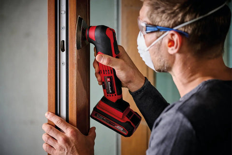 Person using Cordless Oscillating Multi Tool With Accessories 18V Power X Change Brushless For Cutting Sanding And Scraping Wood