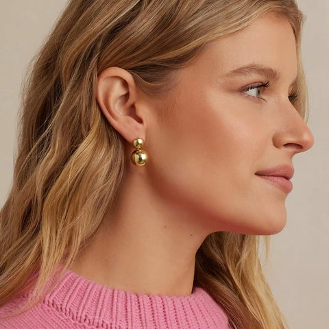 Gold Double Ball Drop Earrings For Women Round Ball Bead Dangle Studs Trendy Jewelry Must Have Hypoallergenic Lightweight Everyday Wear Gift Idea Classic Yet Modern Gold Tone Accessories on model