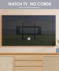 Wall-mounted TV setup with no visible cords, featuring 2 Inch Desk Grommet Cable Management 2 Pack White Cord Hider For Wall Mounted TV Desk