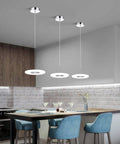Insta Worthy Modern Chrome Pendant Light With 6000K LED Ceiling Fixture illuminating a kitchen island with blue chairs, 2-Pack