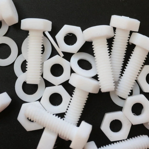 Top Shelf Natural PTFE Hex Head Bolts With Matching Nuts And Washers M6 X 20mm on a dark background, showing plastic fasteners.
