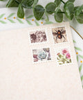Lever Action Postage Stamp Punch 1x0.8 Inch Rectangular Stamp Shaped Paper Punch for Scrapbooking shown on craft paper