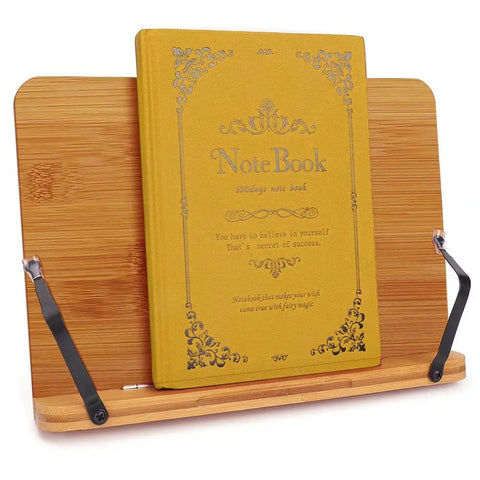 Bamboo Adjustable Book Stand With Tray And Clips, holding a thick notebook, foldable and lightweight, five angle positions.