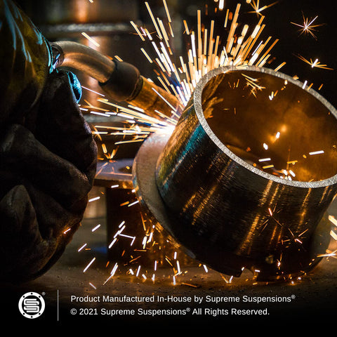 Welding process of a 3.5 Inch Front Suspension Leveling Kit For Ram 2500 And Ram 3500 Trucks, showing steel coil lift spacers.
