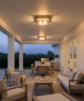 Outdoor Flush Mount Ceiling Light 12 Inch Two Light Antique Brass Industrial Lantern With Seeded Glass installed on porch ceiling