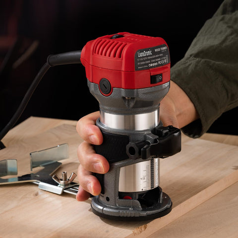 Using Compact Wood Router Tool With 6.5 Amp 1.25 HP Motor, 13000-33000 RPM on wooden surface for precise edging