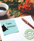 Nine Pad Cat Themed Sticky Notes Set In Pink With Super Adhesive Self Stick Notes, shown on desk near pen and coffee