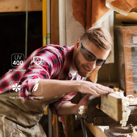 Heavy Duty Clear Safety Glasses For Guys Ansi Z87.1 Polycarbonate Eye Shields Scratch Proof Wind Dust Guard Built Tough For Indoor Outdoor Job Sites 30 Pack on a man working on wood.