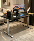 Electric Adjustable Standing Desk With Dual Motor Synchronized Lift For Home Office Computer Setup Oversized Work Surface in modern workspace.