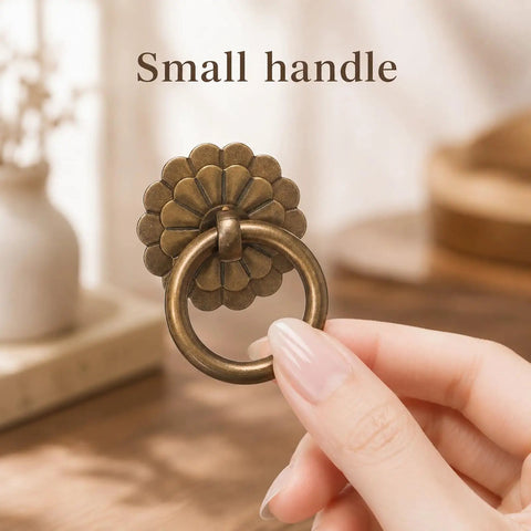 Six Piece Antique Brass Cabinet Ring Pulls Bringing A Flat Out Vintage Drop Ring Vibe To Your Kitchen Cabinets Ideal For Fast Furniture Refreshes And Smooth Daily Access, showing a small handle with flower shaped backplate.