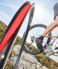 Cyclist on rocky terrain with Rim Tape Set For Road And Mountain Bikes, 700C Fit, 18-20mm Tire Rim Strips, Durable PVC Rim Liner, 10 Pieces.