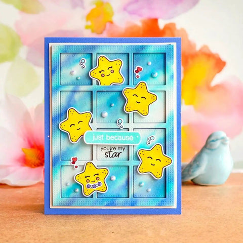 Handmade card with yellow star embellishments and blue background, featuring 'Just Because You're My Star' text, floral accents.