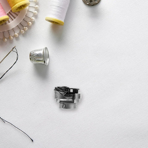 Pro Grade Metal Rotary Hook Sewing Machine Part For Flat Bed Industrial Machines With Advanced Computer Control And Precise Stitching Performance Dark Bobbin Case Accessory Designed For Heavy Duty Bulk Apparel Production And Home Use, metal bobbin case