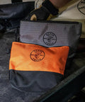 Durable Tool Bag Storage Kit With Stand Up Base And Canvas Zipper Pouches Six Piece Assorted Colors For Easy Access Reinforced Bottom High Capacity Organizer For Pro Job Sites showing orange and gray pouches on toolbox.