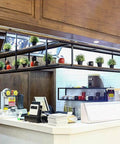 Dope Hanging Wine Glass Rack Ceiling Mount With Black Bracket And Wooden Shelf, Vintage Bottle Holder installed in bar area