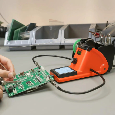 60W LED Display Soldering Station Kit with 2 Helping Hands and PCB board in use on a desktop setup