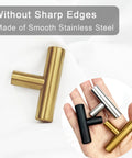 Hand holding 24 Pack Gold T Bar Cabinet Knobs And Drawer Pulls Set For Kitchen Cabinets Cupboards And Dressers With Screws on white backdrop