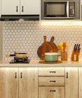 Modern kitchen with Arch Cabinet Pulls 3 Inch Matte Black Solid Zinc Die Cast on wooden cabinets, featuring cookware and utensils.