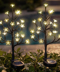 Pink Solar Flower Lights 48 LED Outdoor Garden Stakes by a pool at night, glowing, IP65 Waterproof Decor for Pathway Yard Lawn Patio Walkway