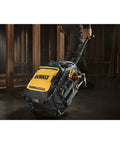 Pro Rolling Tool Backpack On Wheels With IP54 Weatherproof Compartment being wheeled on a construction site