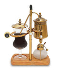 Royal Belgian Siphon Coffee Maker In Gold Retro Siphon Brewer For Rich Clean Tasting Coffee on wooden base, glass and metal design.