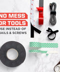 Indoor Double Sided Mounting Tape 1/2 Inch By 80 Inch With Industrial Strength Adhesive, tape roll with tools and accessories on a marble surface.