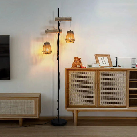 Two Light Rattan Floor Lamp With Independent Control Switch Rustic Farmhouse Tall Standing Lamp 68 Inch next to rattan cabinet in living room