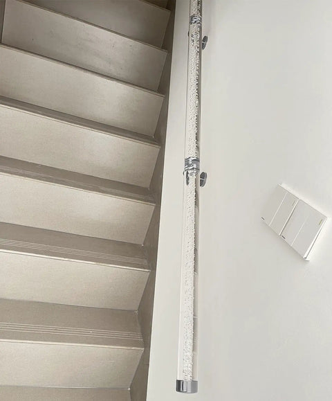 Built Like A Tank Clear Acrylic Stair Railing Kit With Heavy Duty Silver Brackets And Scratch Resistant End Caps For Indoor Outdoor Steps No Sweat Setup Safety Handrail And Modern Balusters 18 Foot Run along light-colored stairs.