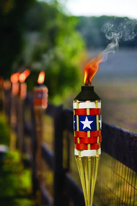 Americana Patriotic Bamboo Torch For Backyard Lighting With FlameKeeper Technology 57 Inch Outdoor Torch in garden