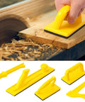 Hand using Five Pack Safety Push Blocks And Push Sticks Set For Table Saw Band Saw And Router Table with high-visibility yellow tools