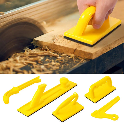 Hand using Five Pack Safety Push Blocks And Push Sticks Set For Table Saw Band Saw And Router Table with high-visibility yellow tools