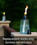 6-Inch Fiberglass Replacement Wicks For Outdoor Glass Torches, Citronella Oil Lamp Burner shown in garden setting