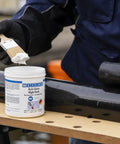 Person applying Anti Seize High Tech Assembly Paste 450 G Metal Free High Temperature Resistant For Corrosion Protection with brush