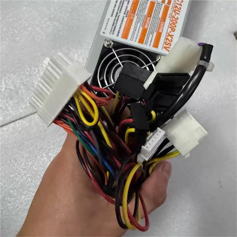 Rock Solid Industrial Computer Power Supply PC12U Series with multi-colored wires, designed for heavy-duty workstations.