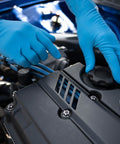 Two hands wearing Workhorse Grade 14 Mil Thick Blue Latex Heavy Duty Industrial Work Gloves With Rock Solid Textured Grip working on a car engine.