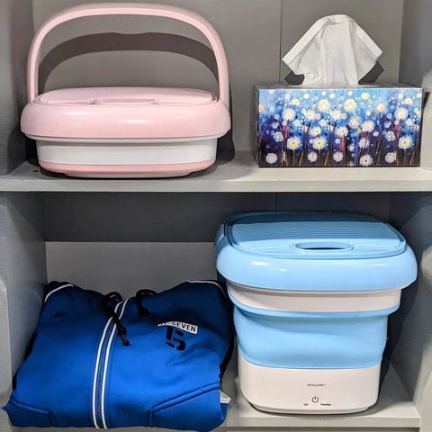 Compact Foldable Portable Washing Machine For Camping And Small Spaces in folded state next to household items