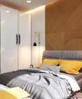 Modern bedroom with matte black cabinet handles on white closet, featuring yellow accents and a geometric wall.