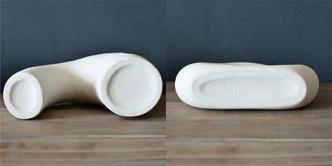 Underside view of the Donut Vase Set Of 2 White Ceramic Vases Large Nordic Minimalist Hollow Centerpieces for stability check.
