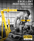 Heavy-Duty 2 Ton Hydraulic Engine Hoist And Cherry Picker Crane with engine hanging, showing 2 ton max capacity in garage.