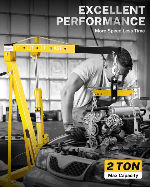 Heavy-Duty 2 Ton Hydraulic Engine Hoist And Cherry Picker Crane with engine hanging, showing 2 ton max capacity in garage.