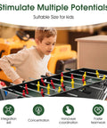 A child playing foosball on a 49 Inch 4 In 1 Combo Game Table Featuring Fast Swap Foosball Slide Hockey Ping Pong And Pool Tops.