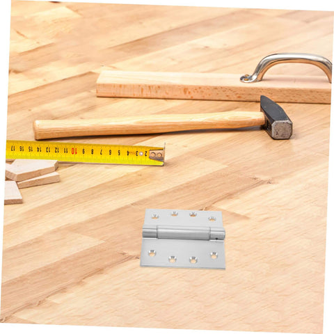 Heavy Duty Adjustable Self Closing Stainless Steel Door Hinges For High Humidity Environments In Kitchens And Bathrooms With Precision Design For Smooth Operation And Elegant Aesthetic next to hammer and tape measure on wooden surface