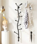 Decorative Wall Mounted Coat Rack Creative Vertical Storage System with black and white hooks for organizing apparel in entryway.