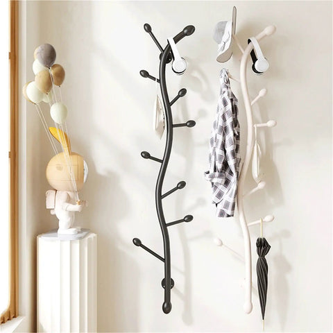 Decorative Wall Mounted Coat Rack Creative Vertical Storage System with black and white hooks for organizing apparel in entryway.