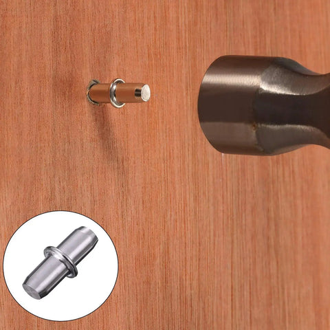 Heavy Duty Shelf Pins 120 Pack Nickel Plated Furniture Shelf Supports 5 Millimeter X 16 Millimeter shown in wood with a hammer.