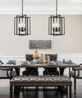 Straight Up Matte Black 3 Light Farmhouse Chandelier With Adjustable Height And Solid Metal Cage Build hanging over a dining table.